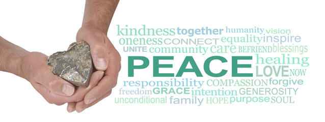Words associated with Peace - male hands holding a wood heart beside a green coloured PEACE word...