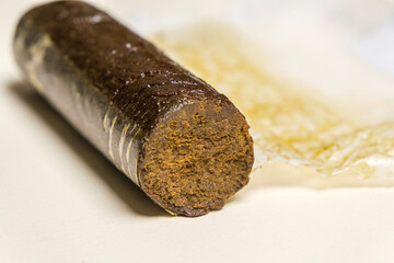 Indian Manali Charas, high quality resin hashish on a white background. Medical marijuana extraction hash cannabis pollen oil