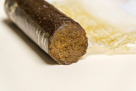 Indian Manali Charas, high quality resin hashish on a white background. Medical marijuana extraction hash cannabis pollen oil