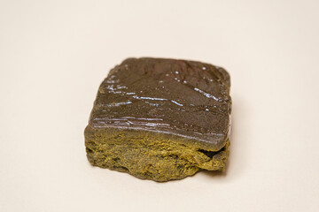 Super dry hash, medical marijuana extraction high quality fresh hashish cannabis pollen with oil on white background.