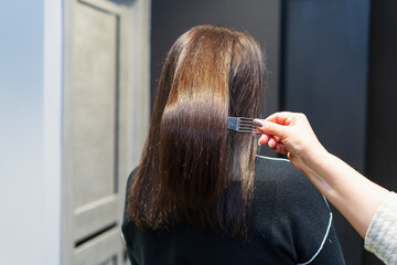 The process of creating hairstyles, hair care. Background, selective focus.