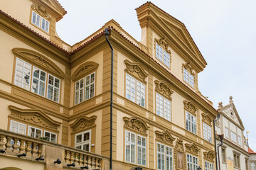 Fototapeta premium Facade of the house of classical European architecture of the old cozy tourist city. Background