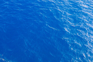 Very nice sea water background or backdrop with selective focus. Small waves of natural water surface texture.