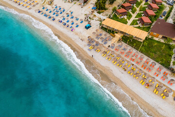 Aerial view of Bunec Beach area with beach umbrellas in Summer 2022, Albania