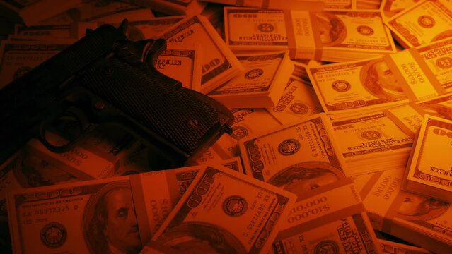 Weapons Business Concept - Gun On Cash Pile