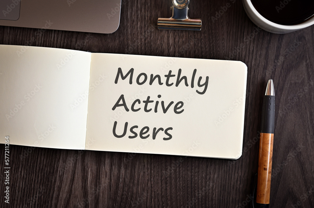 Poster there is notebook with the word monthly active users. it is an eye-catching image.