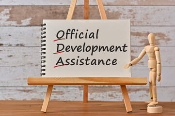 There is notebook with the word Official Development Assistance. It is an eye-catching image.