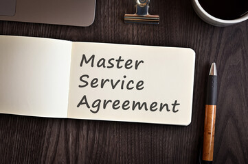 There is notebook with the word Master Service Agreement. It is an eye-catching image.