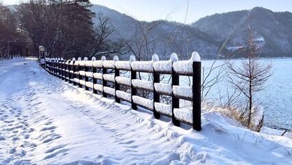 Snowy Fence In Mountains