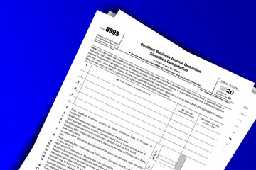 Form 8995 documentation published IRS USA 01.26.2021. American tax document on colored