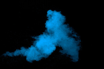 Blue  color powder explosion cloud on black background. Closeup of Blue  dust particles splash.