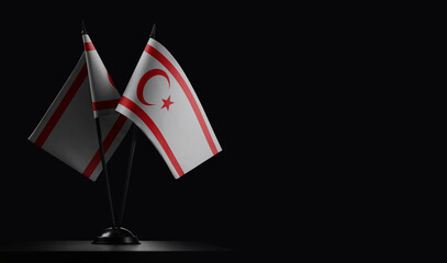 Small national flags of the Northern Cyprus on a black background