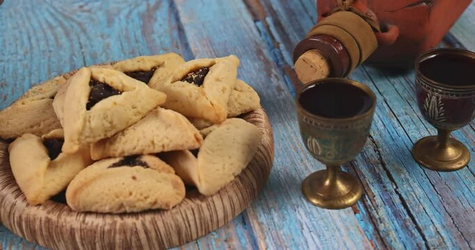 Purim festival is Jewish religious festival celebrated with cookies shofar noisemaker tallite carnival masks and hamantaschens as symbols of celebration