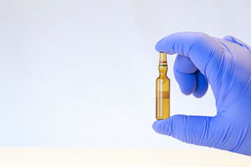 Hand holding an anesthetic container isolated, white background. Lidocaine hydrochloride bottle....