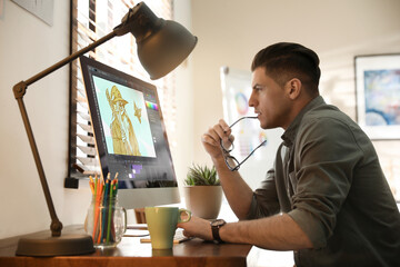 Animator working at table. Modern computer with illustration on screen