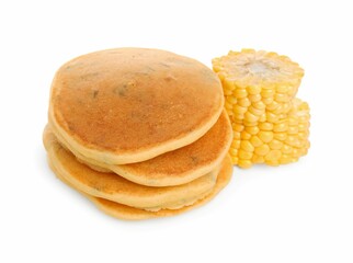 Stack of tasty corn pancakes and cobs isolated on white