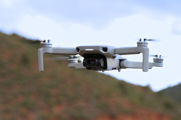 Drone in flight in open field (UAS)
