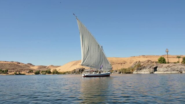 Traditional Felucca Boat Sailing down the Nile River, Aswan Egypt