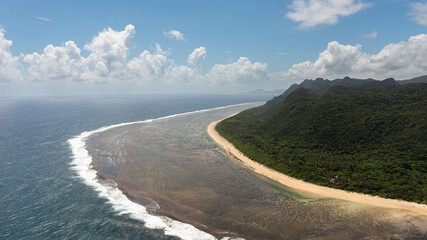 Aerial drone of tropical island coastline and blue ocean. Luzon, Santa Ana, Cagayan. Philippines.