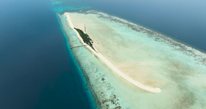 Aerial drone of tropical island on the atoll and coral reef. Timba Timba islet. Tun Sakaran Marine Park. Borneo, Sabah, Malaysia.