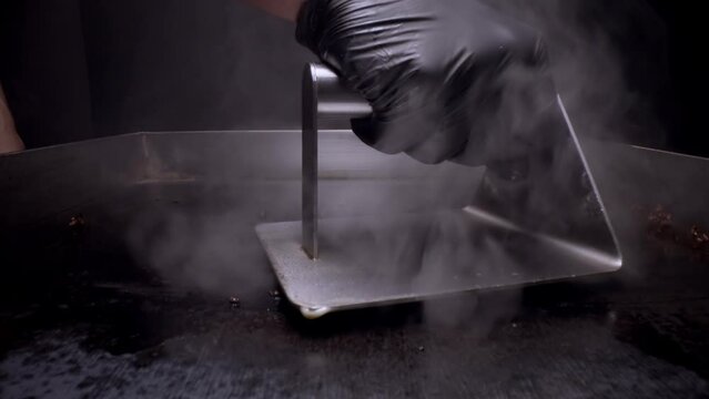 Making smash burger typical American cuisine