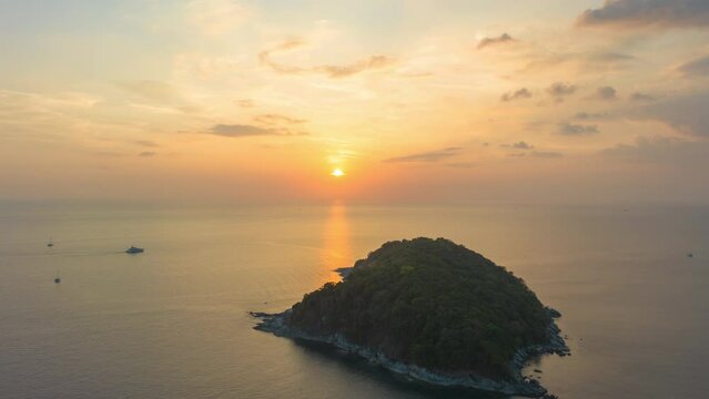 aerial hyperlapse view sunset at Laem Promthep Cape..Promthep cape viewpoint is the most popular viewpoint in Phuket island..time lapse day to night 4K video of Majestic sunset landscape..