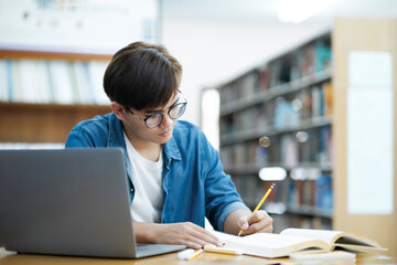Student studying at library.
