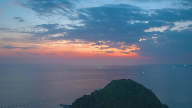 aerial hyperlapse view sunset at Laem Promthep Cape..Promthep cape viewpoint is the most popular viewpoint in Phuket island..time lapse day to night 4K video of Majestic sunset landscape..