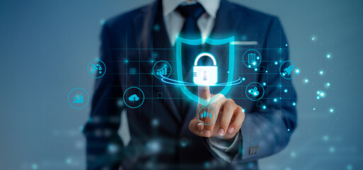 Fototapeta na wymiar Security Technology concept. Businessman finger touching and connecting to lock and unlock world big data blue background.