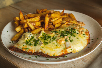 Milanesa Neapolitan 4 cheeses Argentine style with French fries.
