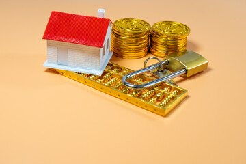 Mini house on stack of coins. Concept of Investment property.