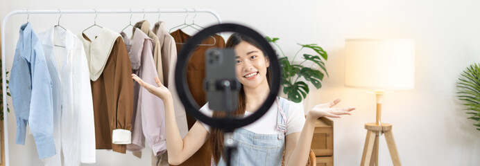 Beautiful woman with a social media influence is greeting the audience for recording vlog video live streaming, Online fashion clothing business, Using psychology to generate interest in customers.