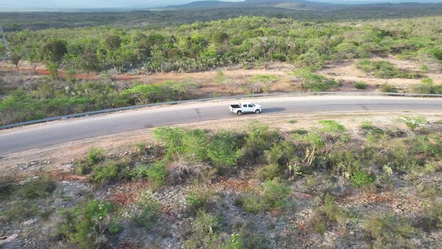 Drone footage Driving white pick up in the middle of a lonely but beautiful landscape