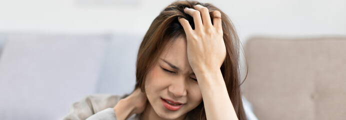 Stressed woman holding her temples with severe problems in her life, Family problems, Pressure from...