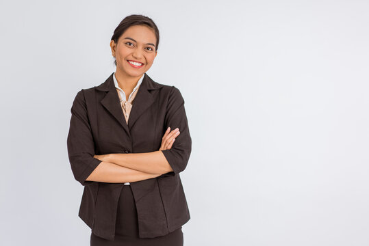 asian woman in formal outfit standing with handcrossed on isolated background