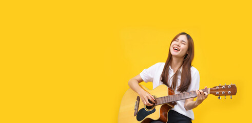 Banner with blank copyspace, Women are playing acoustic guitar and singing the song over isolated...