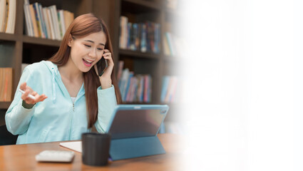 Banner with blank copyspace, Education concept, Teenage girl talking on smartphone while watching video math tutorial on tablet