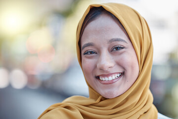 Happy, smile and portrait of Muslim woman in city for travel, relax and natural in Indonesia. Islamic, positive and confident with girl wearing hijab in urban town for calm, weekend and happiness