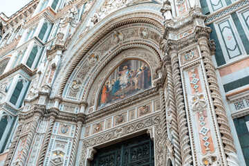 Fototapeta na wymiar Detail of the facade of the Cathedral of Santa Maria del Fiore in Florence, Italy