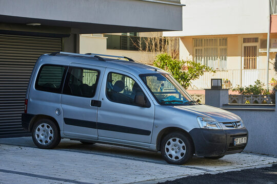 Side, Turkey - February 11, 2023:  silver  Berlingo Multispace  is  parking   on the street on a warm   day