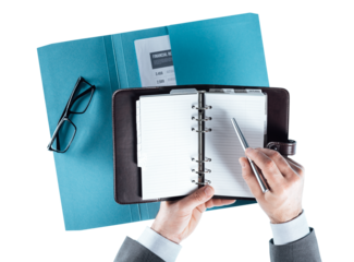 Businessman checking schedule on the organizer