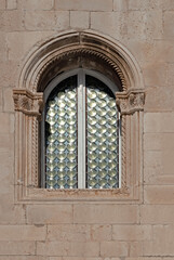 Fototapeta na wymiar Ornate window on ancient building in Dubrovnik, Croatia