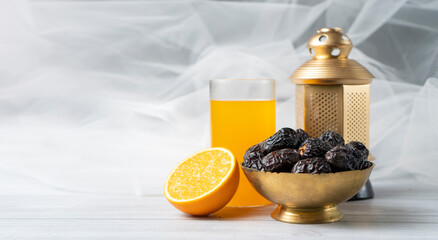Iftar meal image juice and dates in a golden bowl with lantern lamp