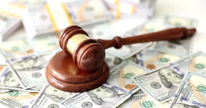 Judge gavel many of dollars for business and financial corruption