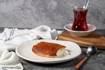 Milky dessert or Kazandibi. Traditional Turkish cuisine desserts. Kazandibi on a dark background