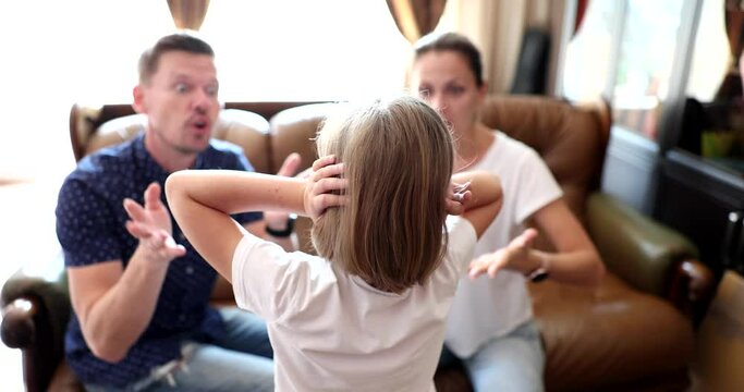 Mother and father yell at little daughter and scold