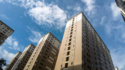 High rise apartment building complex with blue sky