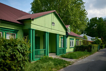 Fototapeta na wymiar Green wooden house of Osiedle 