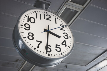 Classic Train Station Clock. Working hours Office Time in urban city landscape in people lifestyle.