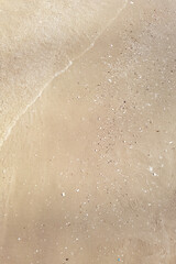 Wave of the sea on the sand beach